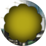 round yellow glass button with metal frame